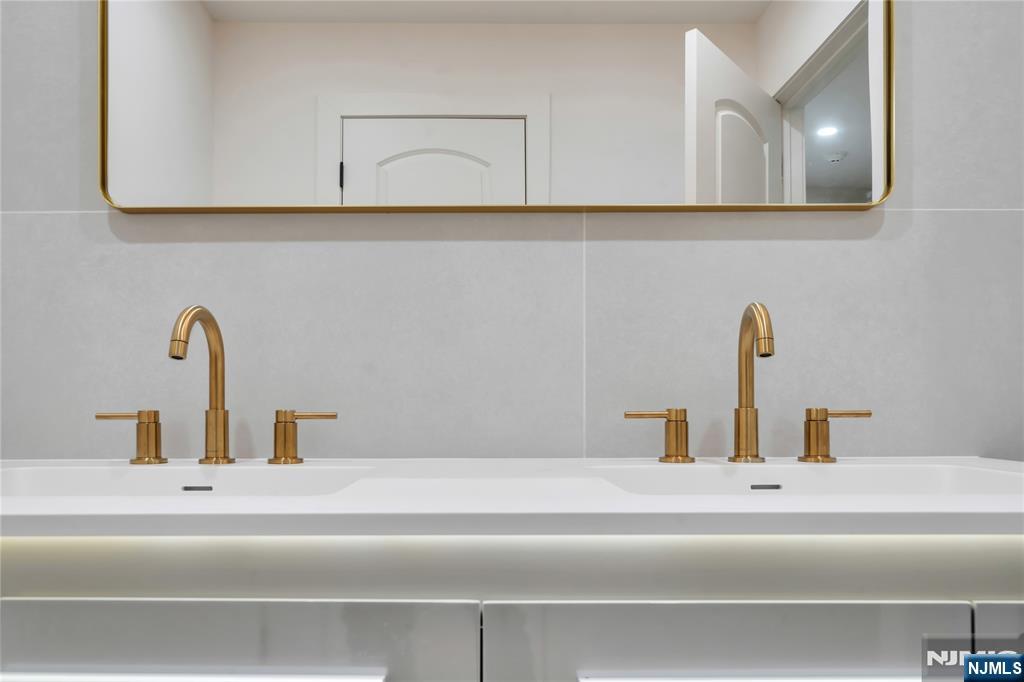 468 Morse Avenue Ridgefield, NJ 07657 - Photo 23 of 48 a bathroom with a sink and mirror