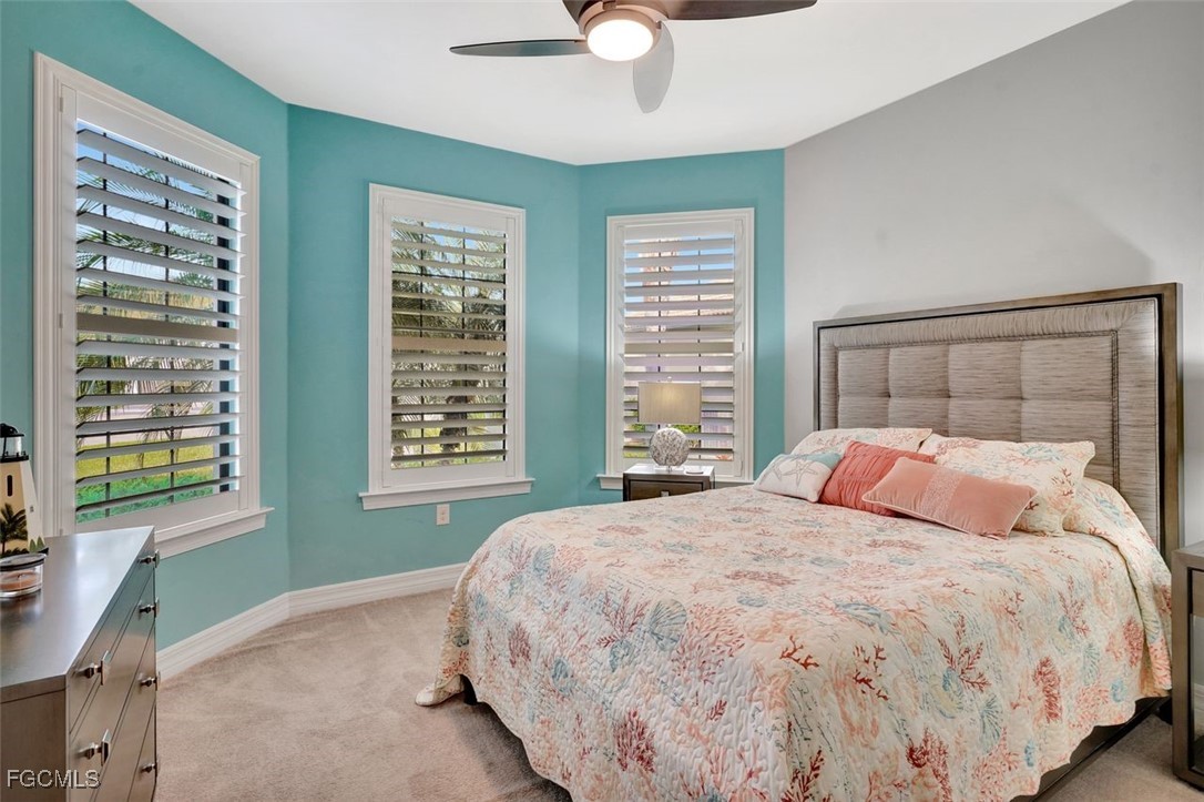 11812 Clifton Terrace Fort Myers, FL 33913 - Photo 16 of 46 a bedroom with a large bed and a window