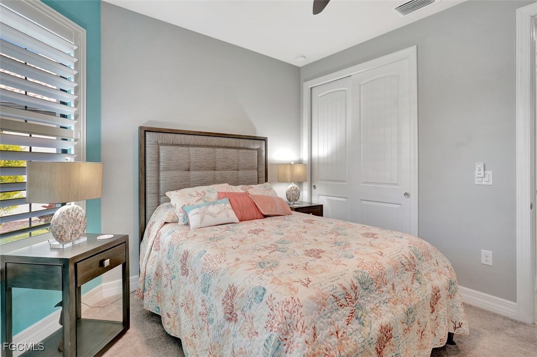 11812 Clifton Terrace Fort Myers, FL 33913 - Photo 17 of 46 a bedroom with a bed and window