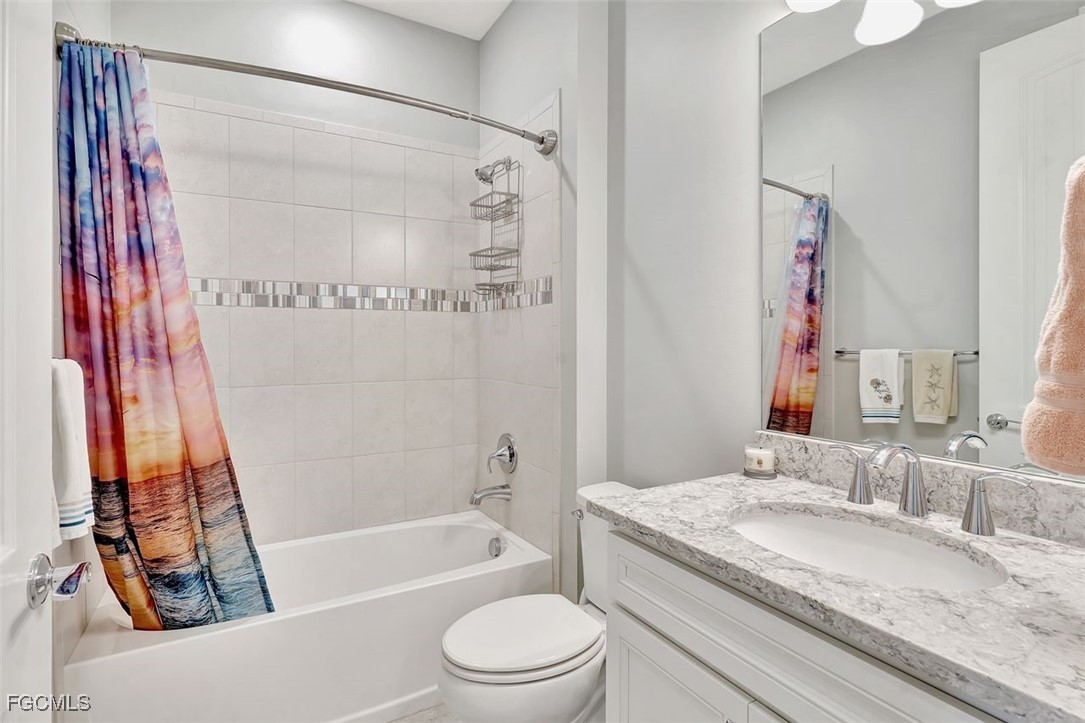 11812 Clifton Terrace Fort Myers, FL 33913 - Photo 18 of 46 a bathroom with a granite countertop sink toilet and shower