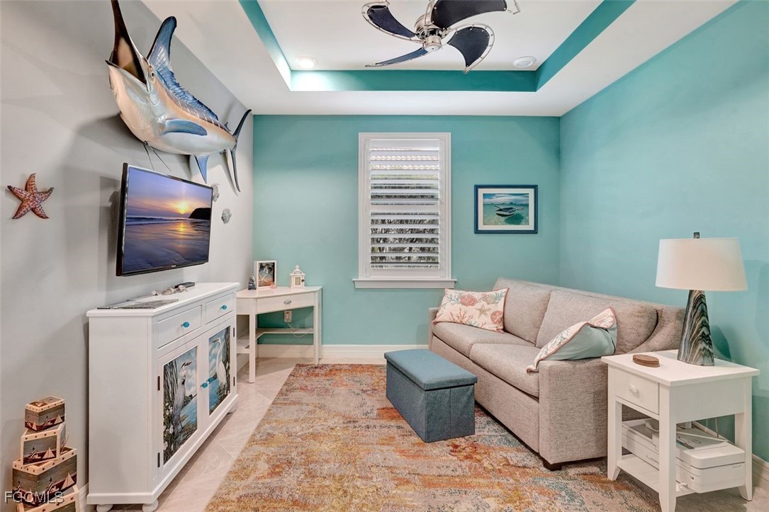 11812 Clifton Terrace Fort Myers, FL 33913 - Photo 19 of 46 a living room with furniture and a flat screen tv