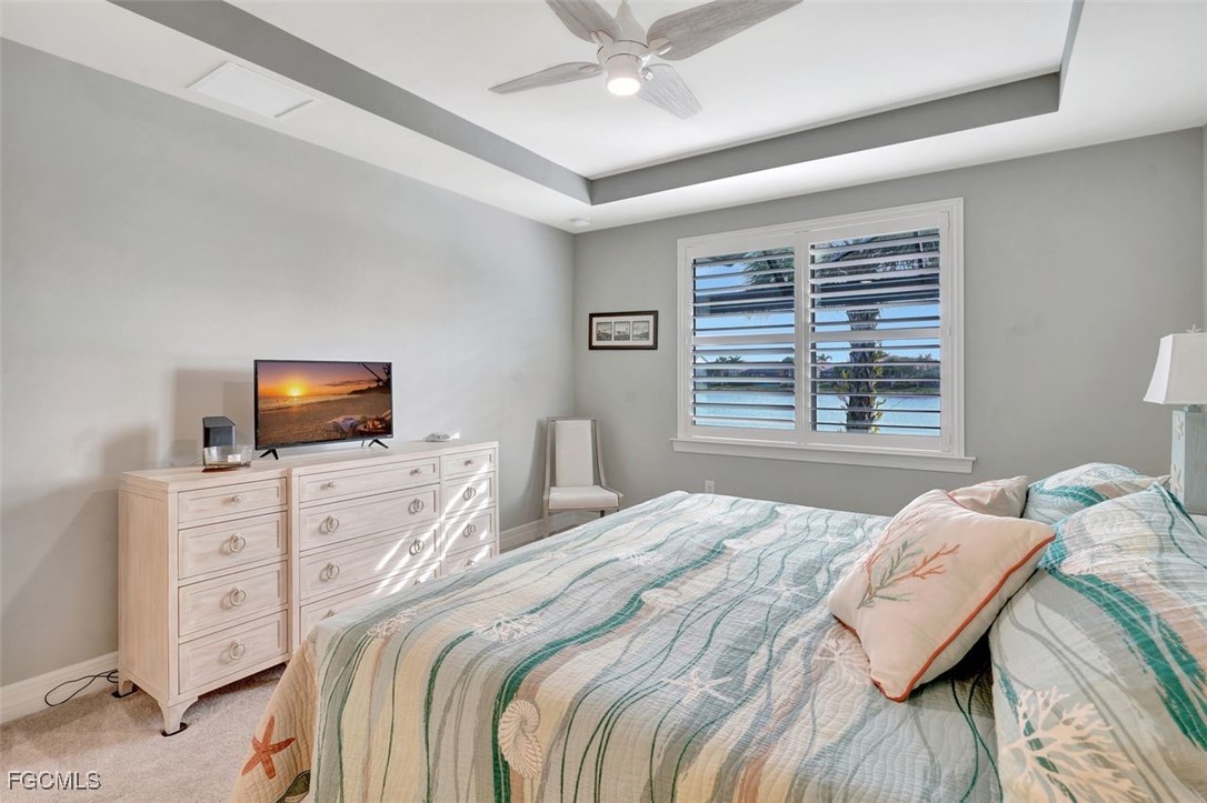 11812 Clifton Terrace Fort Myers, FL 33913 - Photo 22 of 46 a bedroom with a bed and a television