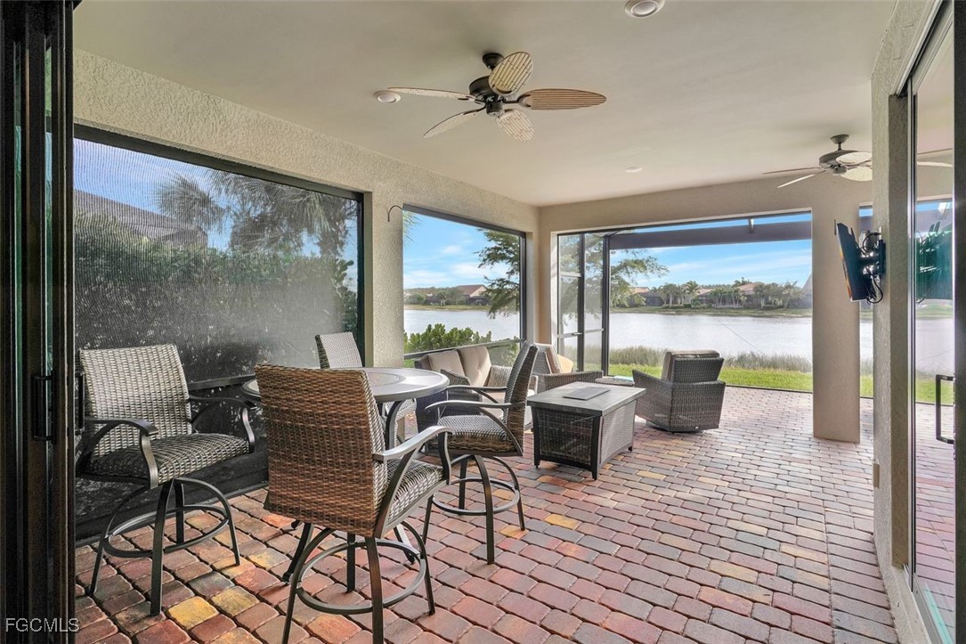 11812 Clifton Terrace Fort Myers, FL 33913 - Photo 26 of 46 a view of a dining room with furniture large windows and wooden floor