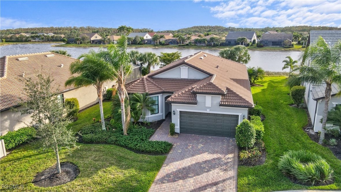 11812 Clifton Terrace Fort Myers, FL 33913 - Photo 33 of 46 an aerial view of a house with a garden and lake view