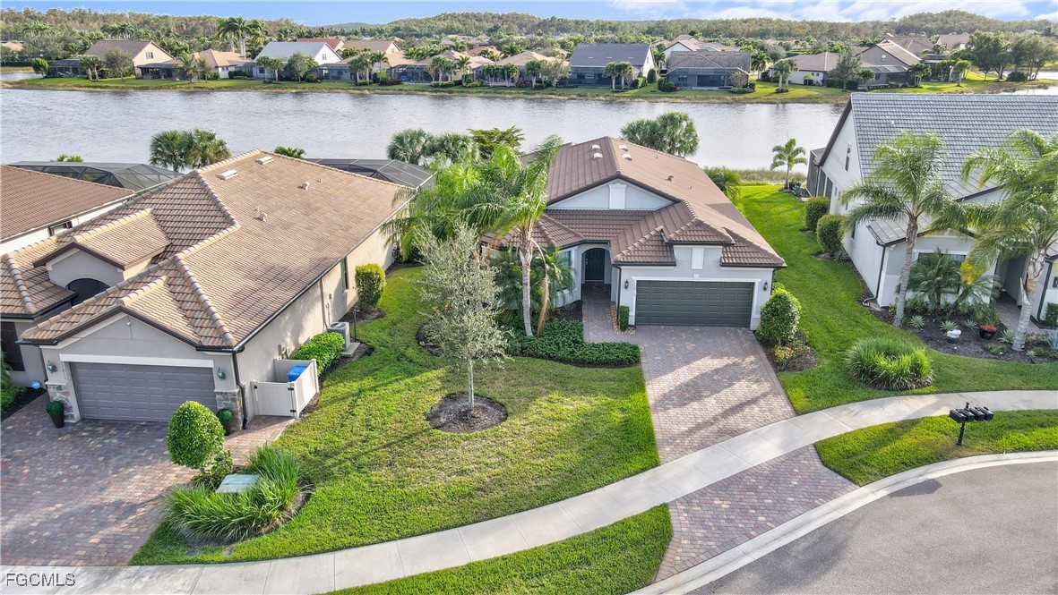 11812 Clifton Terrace Fort Myers, FL 33913 - Photo 34 of 46 an aerial view of a house with outdoor space and lake view