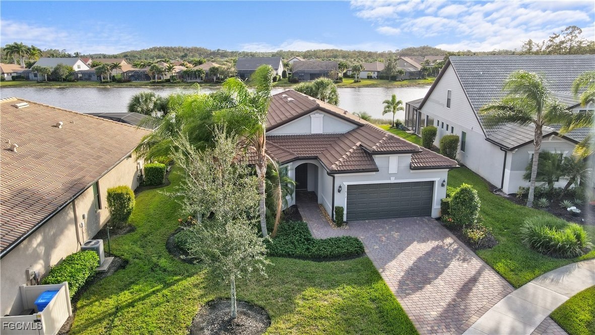 11812 Clifton Terrace Fort Myers, FL 33913 - Photo 36 of 46 a front view of a house with a yard and mountain view in back