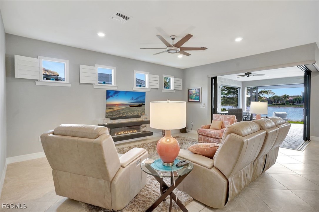 11812 Clifton Terrace Fort Myers, FL 33913 - Photo 5 of 46 a living room with furniture and a wooden floor
