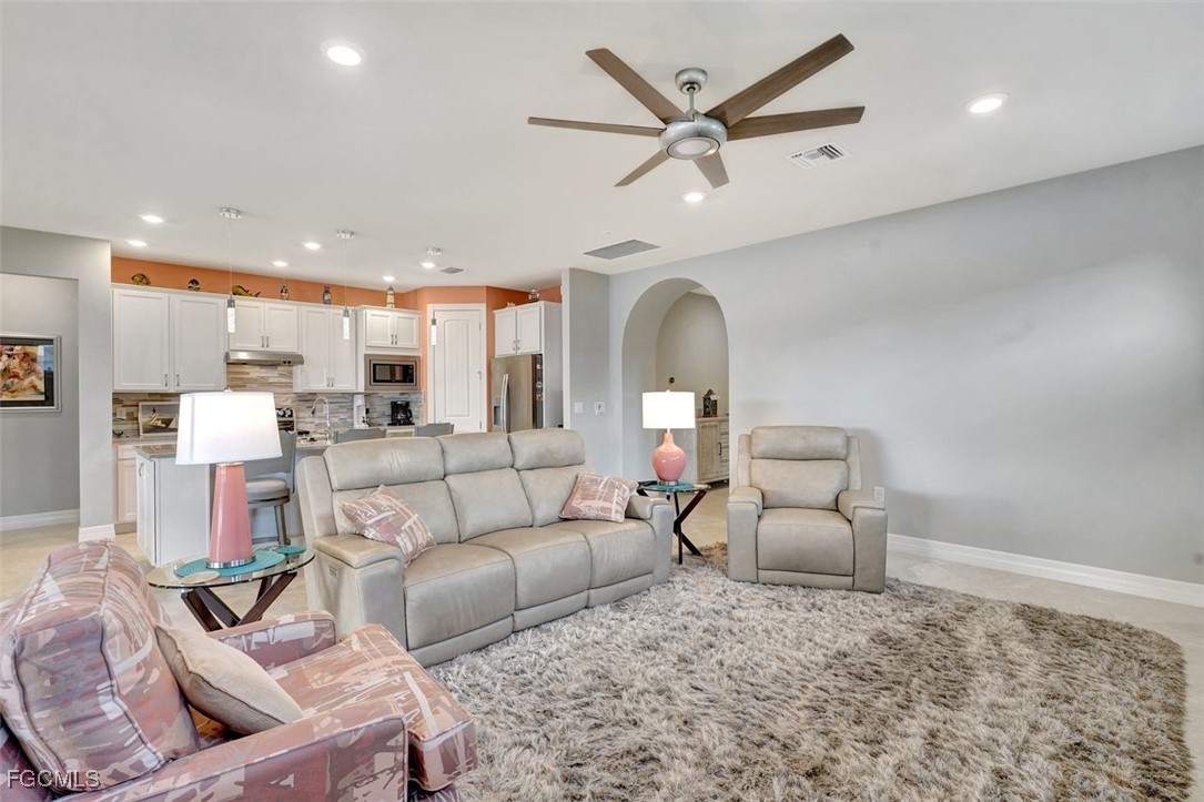 11812 Clifton Terrace Fort Myers, FL 33913 - Photo 6 of 46 a living room with furniture and a wooden floor