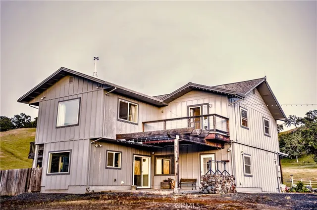 a front view of a house with a wrought fence
