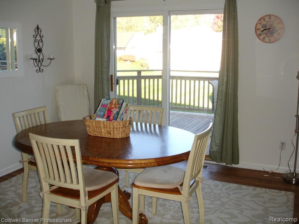 3344 Woodcrest Road Rochester, MI 48309 - Photo 13 of 23 The dining room has hardwood flooring and access to the large deck.