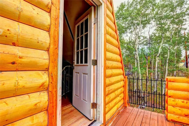 a narrow alley way with furniture and wooden floor