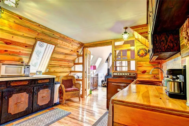 a view of a living room and workspace