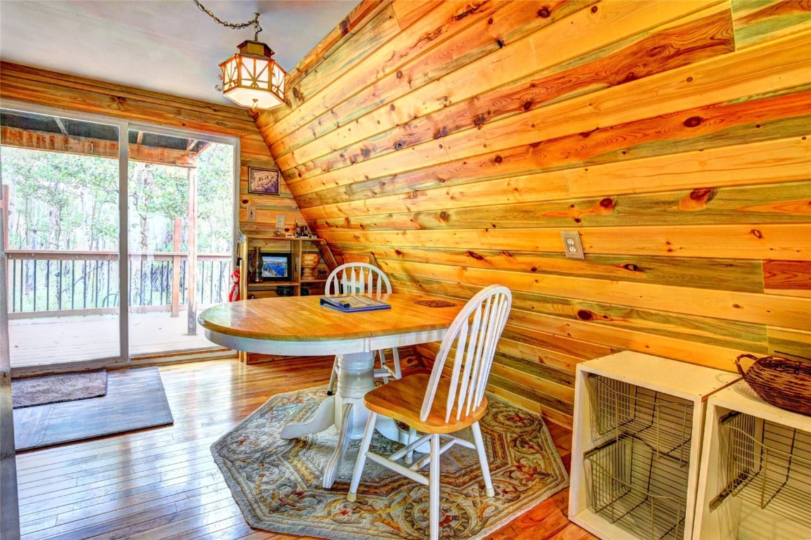 567 Haida Road Como, CO 80456 - Photo 23 of 50 a view of a dining room with furniture and a chandelier