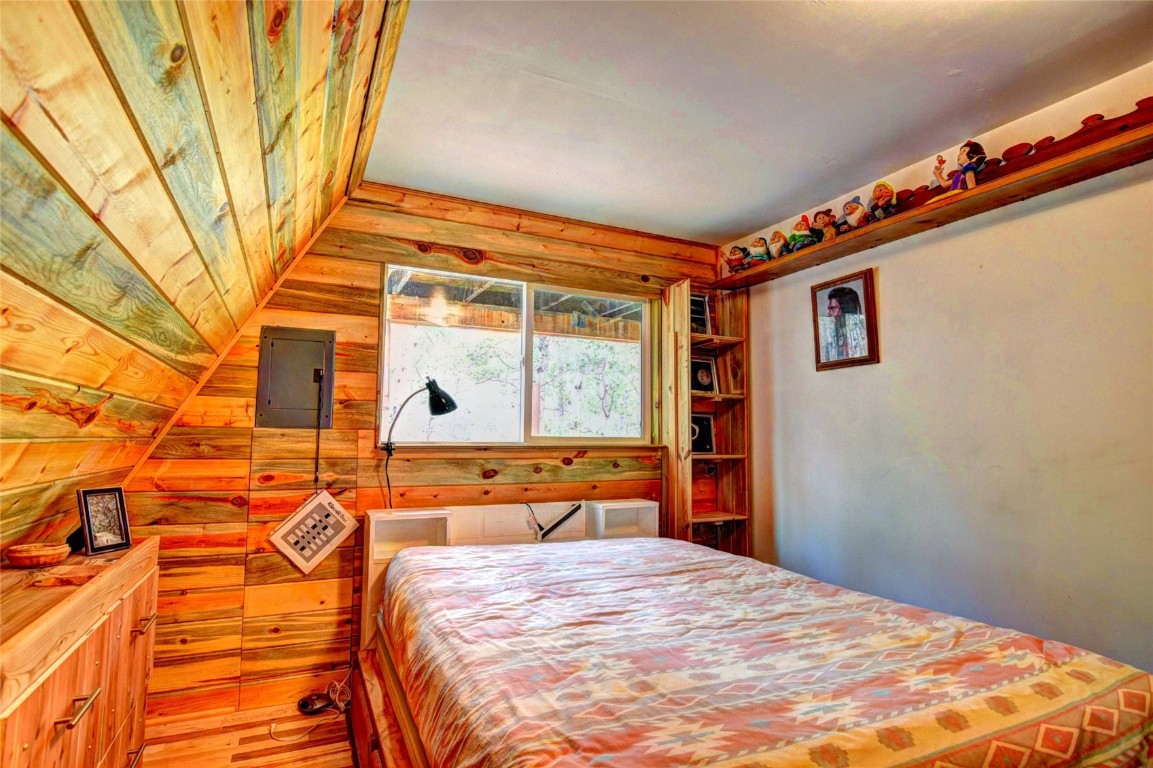 567 Haida Road Como, CO 80456 - Photo 28 of 50 a bed sitting in a bedroom next to a window