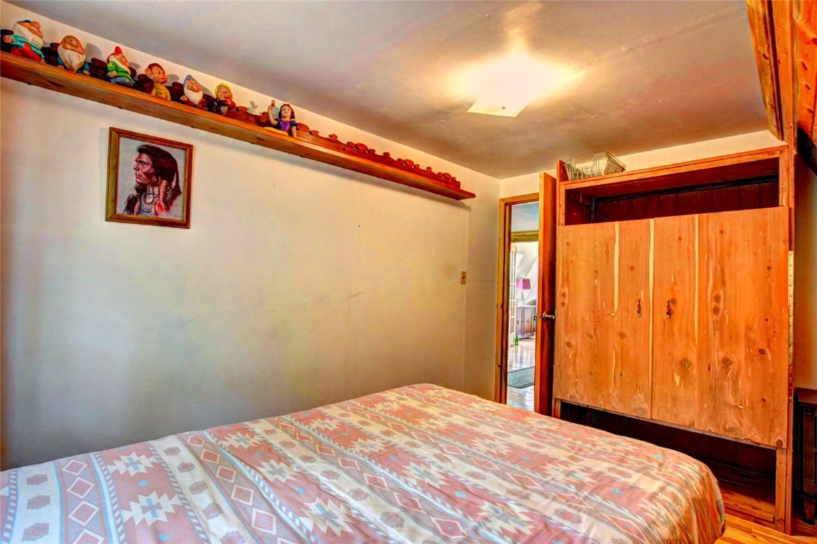 567 Haida Road Como, CO 80456 - Photo 29 of 50 a bedroom with a bed and a window