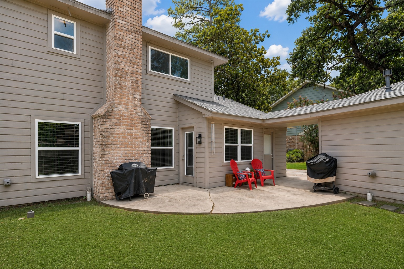 4026 Oxhill Road Spring, TX 77388 - Photo 32 of 40 Enjoy a cozy patio just off the family room, perfect for grilling, relaxing with a morning coffee, or gathering with family and friends. A convenient exterior entrance provides easy access to the home.