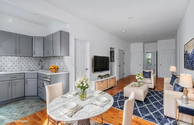 a view of a kitchen with a sink and dishwasher cabinets