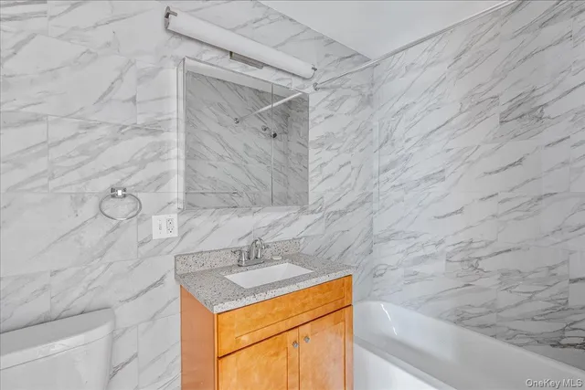 a kitchen with appliances cabinets and a sink