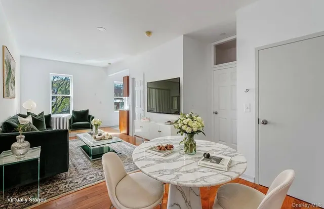 a view of a kitchen with granite countertop cabinets and wooden floor