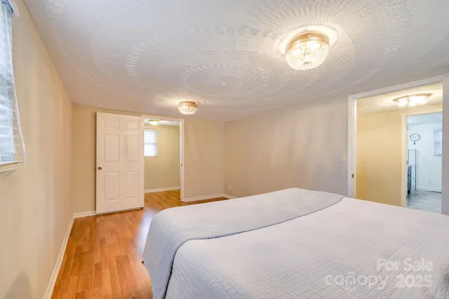 a view of a room with wooden floor