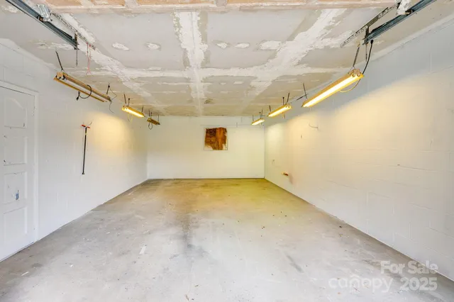 a living room with furniture a rug and a chandelier