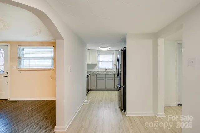 a kitchen with granite countertop cabinets sink and window
