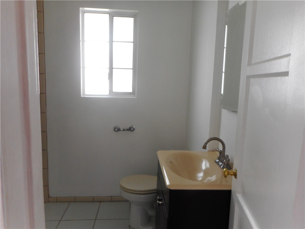 4267 Van Nuys Boulevard Sherman Oaks, CA 91403 - Photo 13 of 17 a bathroom with a sink toilet and mirror