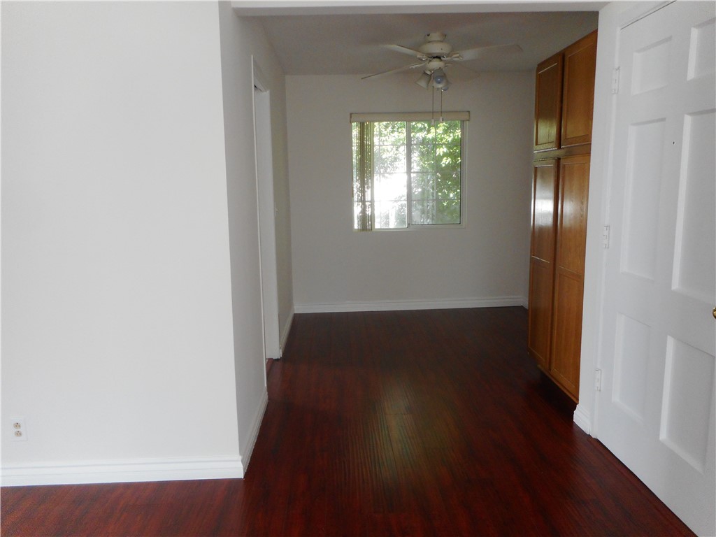 4267 Van Nuys Boulevard Sherman Oaks, CA 91403 - Photo 5 of 17 an empty room with wooden floor and windows
