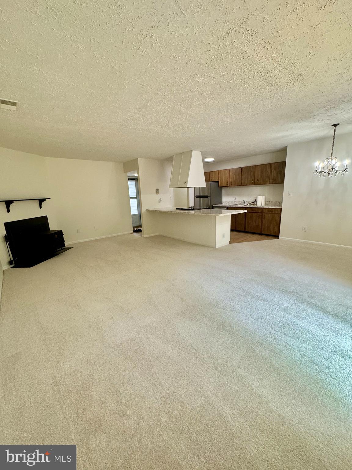 11412 Turnmill Lane Reston, VA 20191 - Photo 5 of 23 Living room facing kitchen, corner