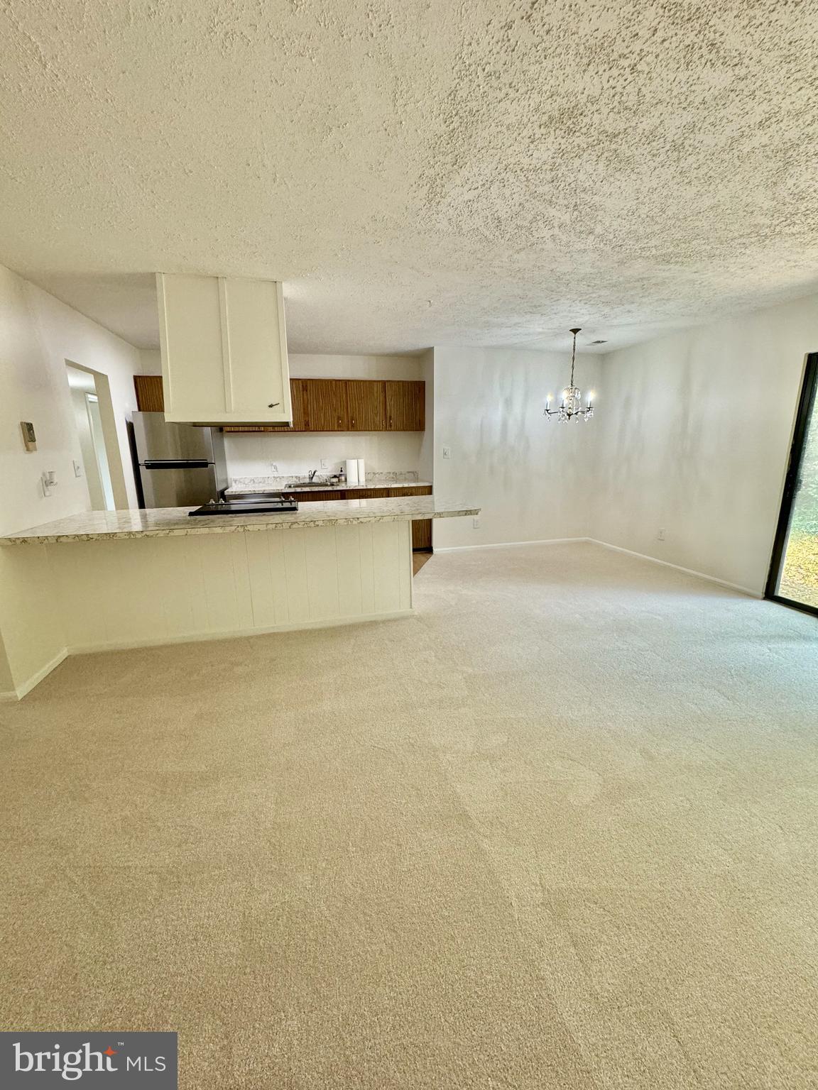 11412 Turnmill Lane Reston, VA 20191 - Photo 6 of 23 Living room facing kitchen, straight on