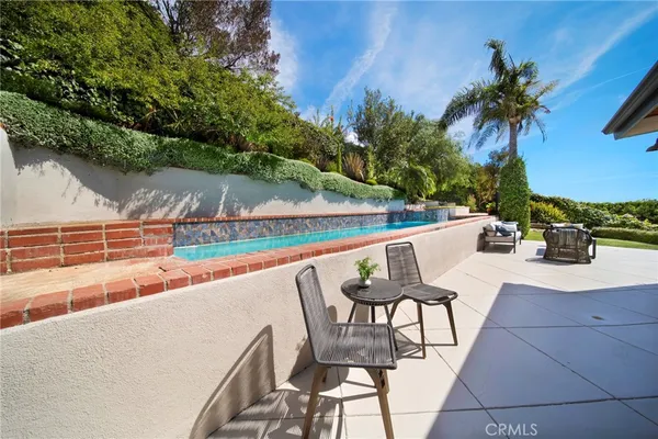 a view of a water fountain in front of a house