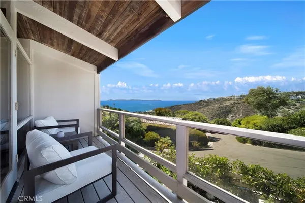 a view of balcony with furniture