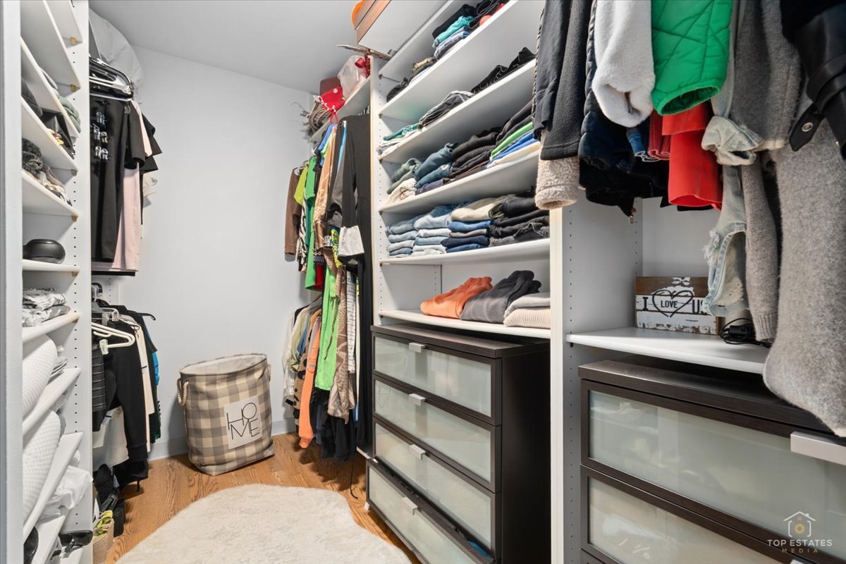 1405 East Central Road, Unit 222C Arlington Heights, IL 60005 - Photo 24 of 45 a view of walk in closet with clothes and shoes