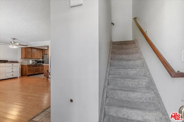 a view of a kitchen with microwave and cabinets
