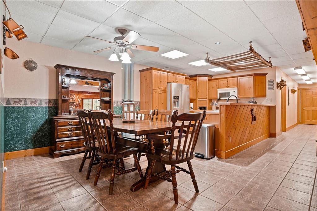 1850 Carter Road Volant, PA 16156 - Photo 13 of 23 a view of a dining room with furniture window and wooden floor