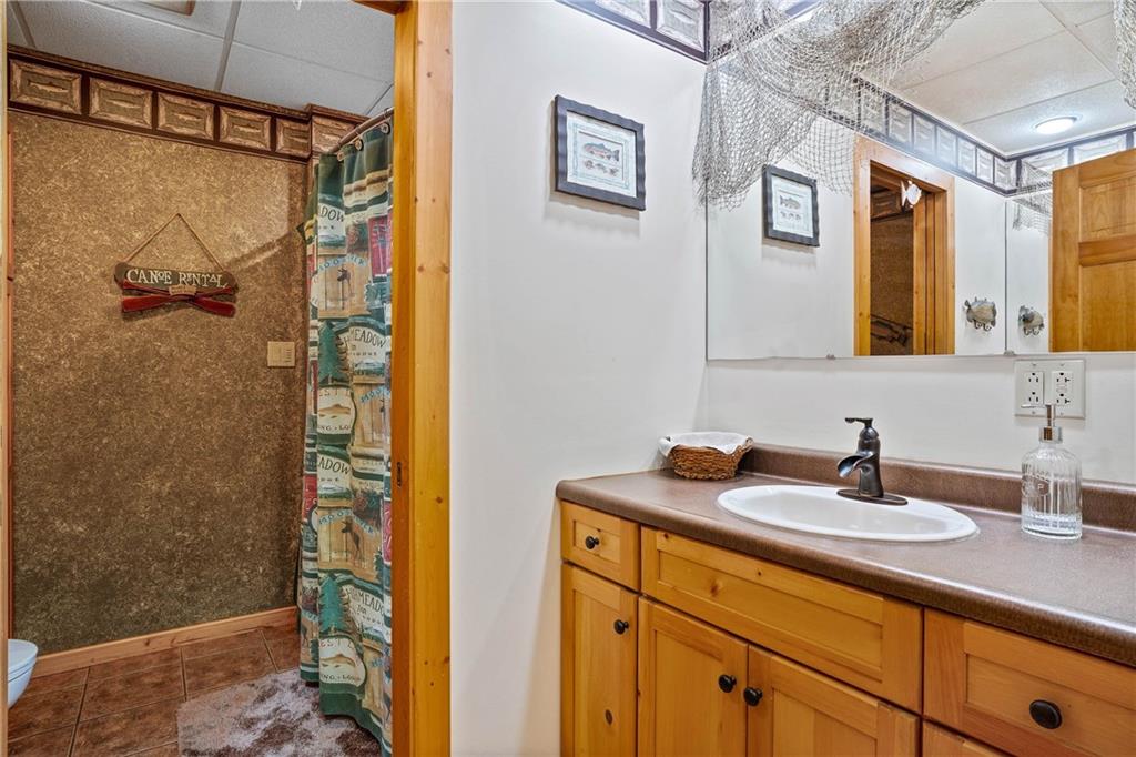 1850 Carter Road Volant, PA 16156 - Photo 18 of 23 a bathroom with a sink a mirror and shower