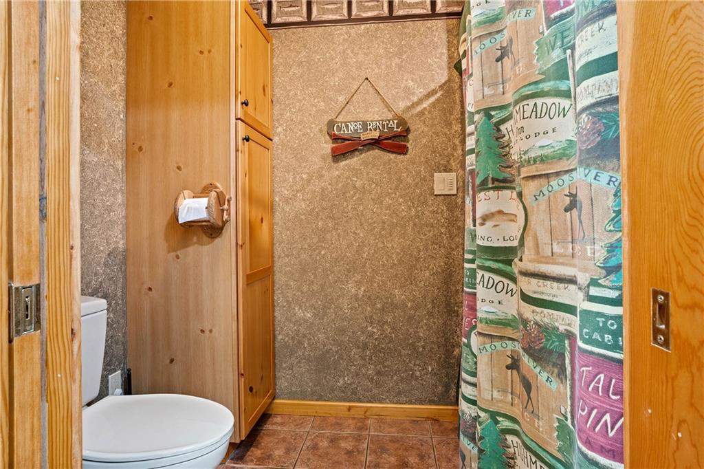 1850 Carter Road Volant, PA 16156 - Photo 19 of 23 a bathroom with a toilet and shower