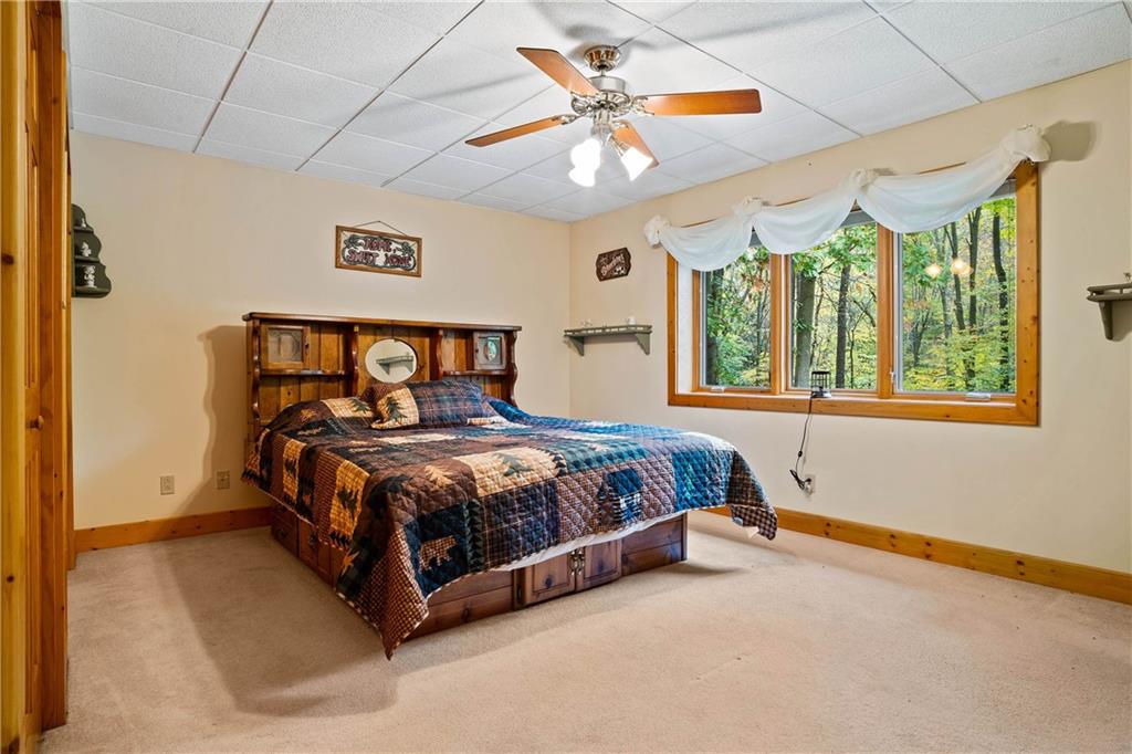1850 Carter Road Volant, PA 16156 - Photo 20 of 23 a bed sitting in a bedroom next to a window