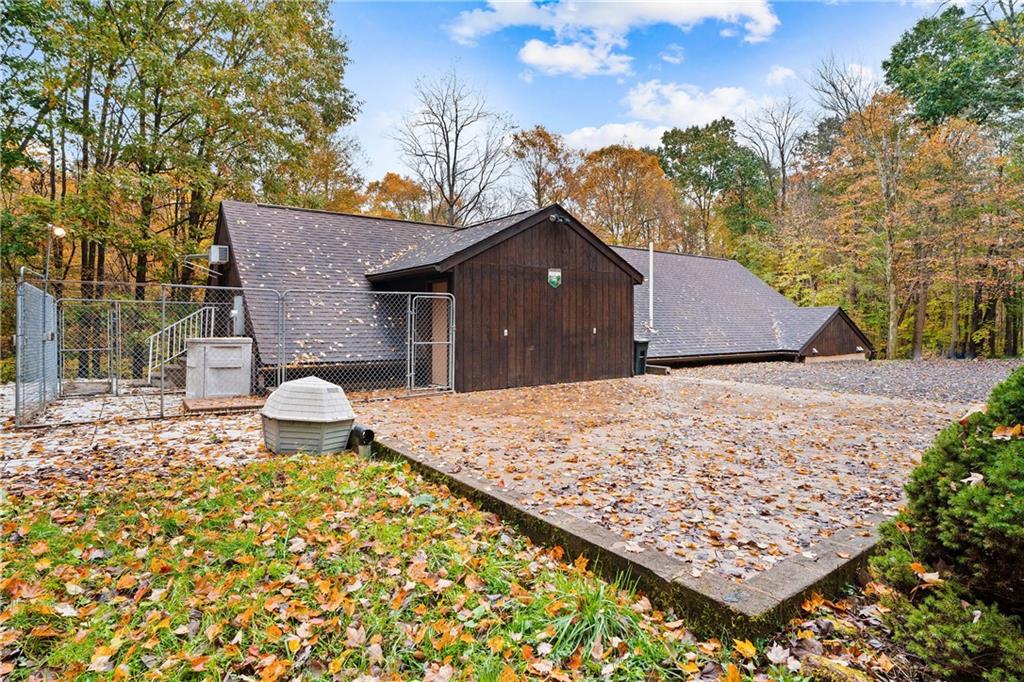 1850 Carter Road Volant, PA 16156 - Photo 3 of 23 a view of a house with a yard and covered with tall trees