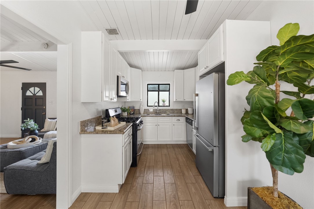 18018 East Armstead Street Azusa, CA 91702 - Photo 11 of 43 a kitchen with a sink stainless steel appliances and cabinets