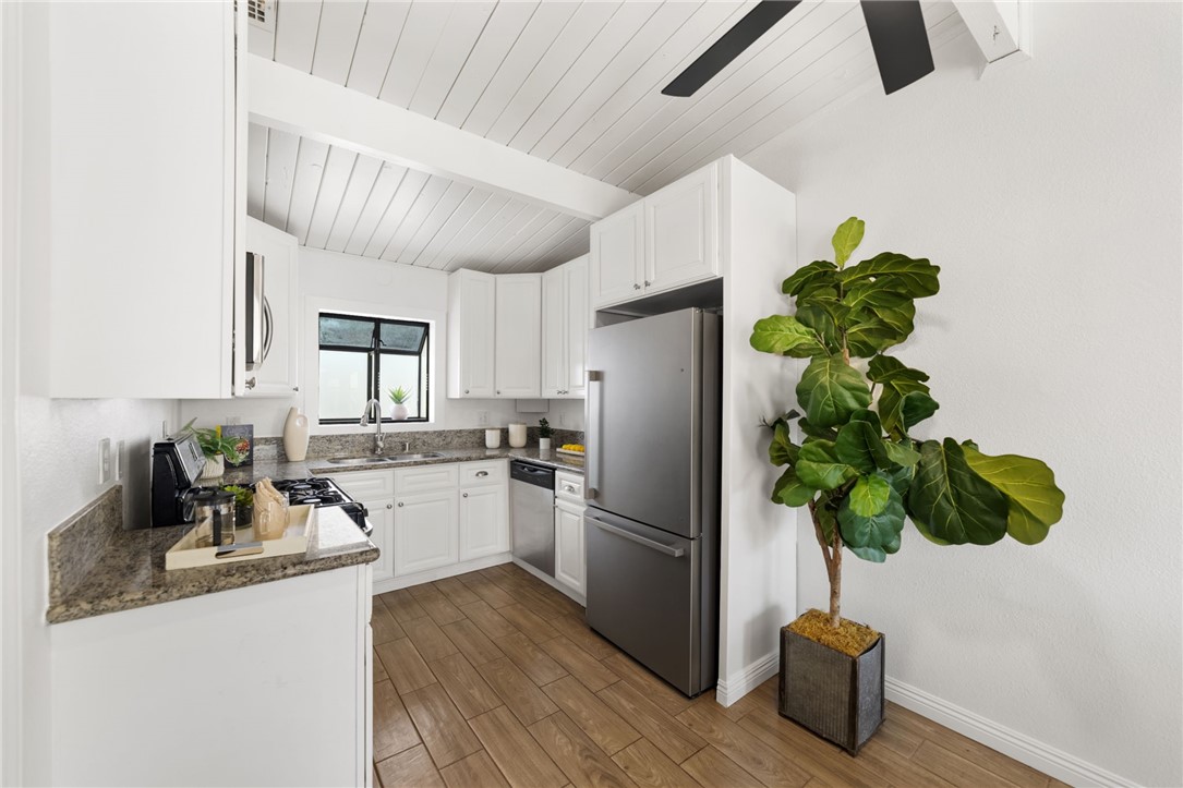 18018 East Armstead Street Azusa, CA 91702 - Photo 12 of 43 a kitchen with stainless steel appliances granite countertop a refrigerator a sink a counter space and cabinets