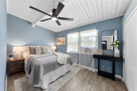 a bedroom with a bed and a table