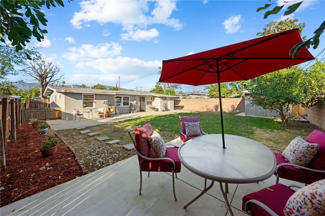 18018 East Armstead Street Azusa, CA 91702 - Photo 26 of 43 a view of a chairs and table under an umbrella
