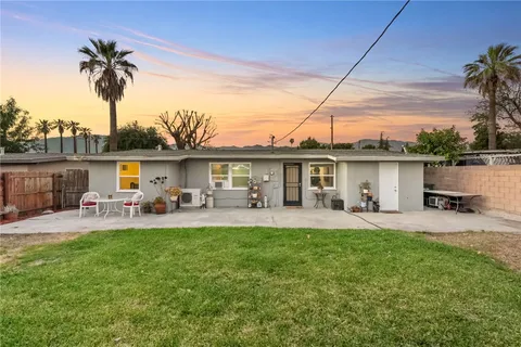 a front view of house with yard and seating area