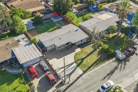 an aerial view of a house with a swimming pool