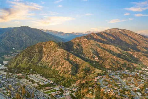 a view of a mountain range in a cloudy sky