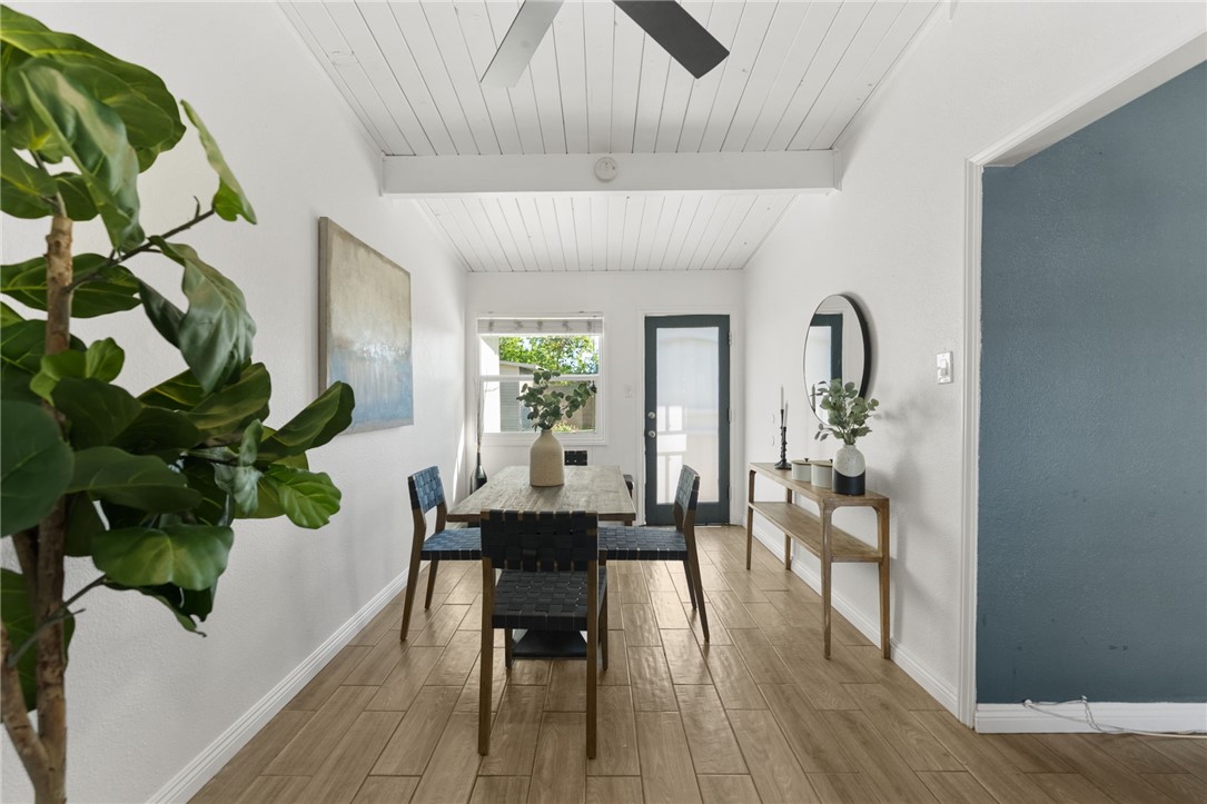 18018 East Armstead Street Azusa, CA 91702 - Photo 8 of 43 a dining room with furniture a potted plant and wooden floor