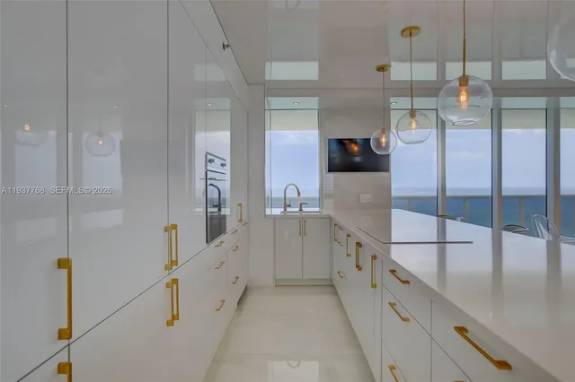 a bathroom with a shower and a sink