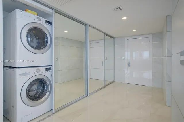 a view of a hallway with washer and dryer