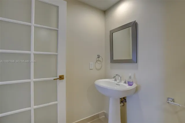a bathroom with a sink and a mirror